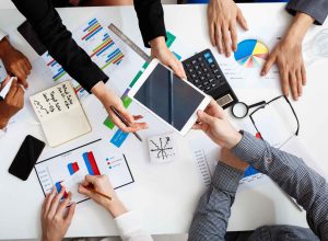businessmen-hands-white-table-with-documents-drafts (1)